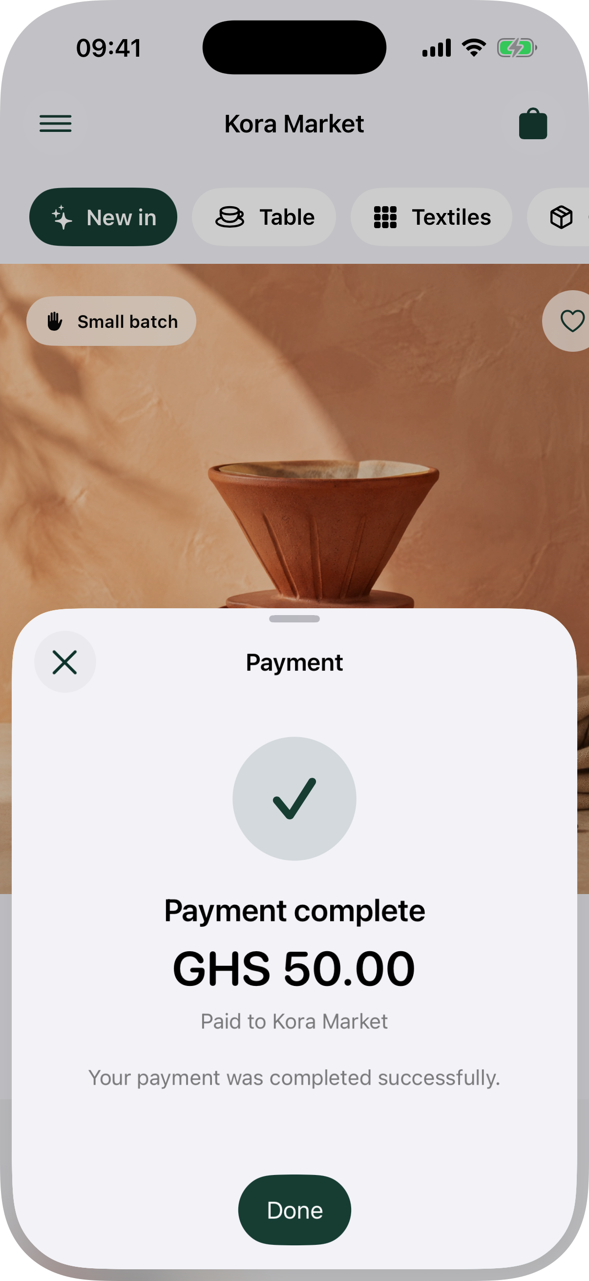 Native Inttegro payment sheet in light appearance confirming a completed GHS 50 Mobile Money payment to Kora Market.